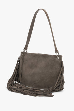 A profile shot of the bag highlighting its optimal depth of 13 cm, a comfortable shoulder strap, and silver metal hardware.