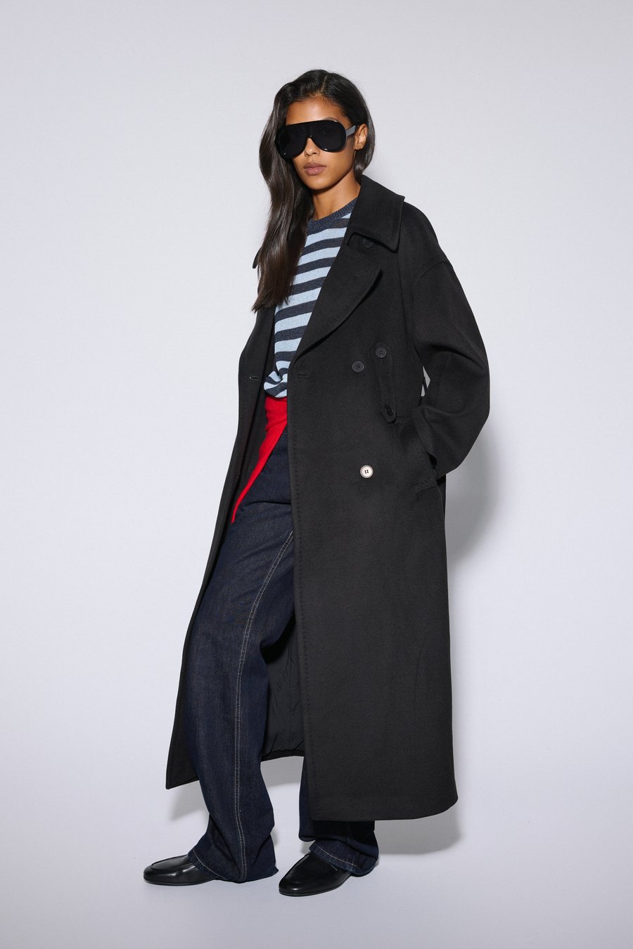 Women's double-breasted black ankle-length natural wool coat with tie belt by Estro.