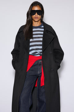 Long women's black natural wool coat, double-breasted design with a belt by Estro.