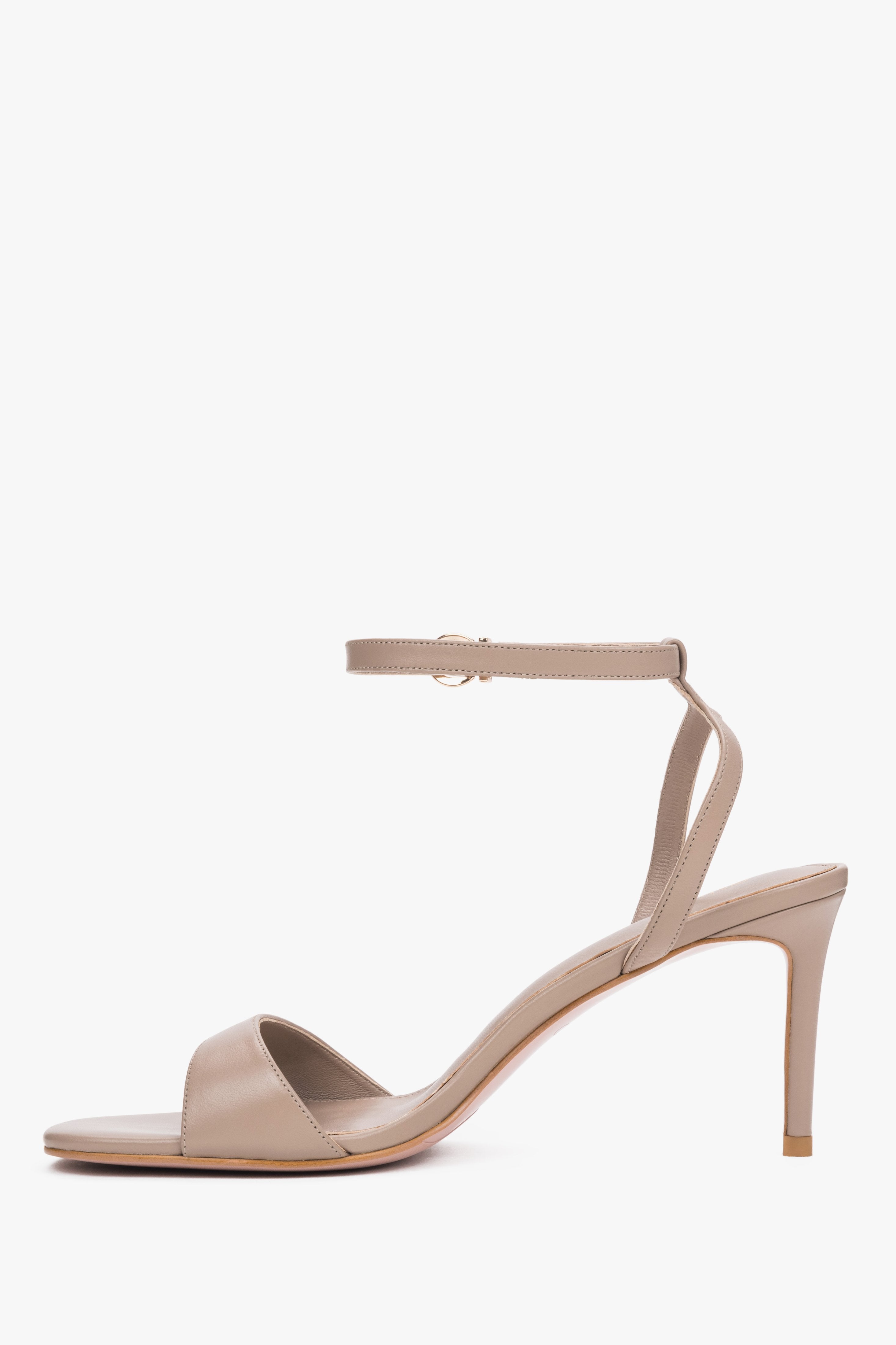 Elegant beige leather high-heel sandals with chevro lining.