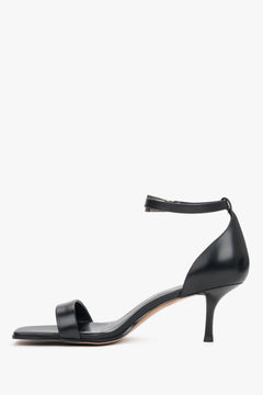 Classic black leather strappy sandals for women with an adjustable ankle buckle.