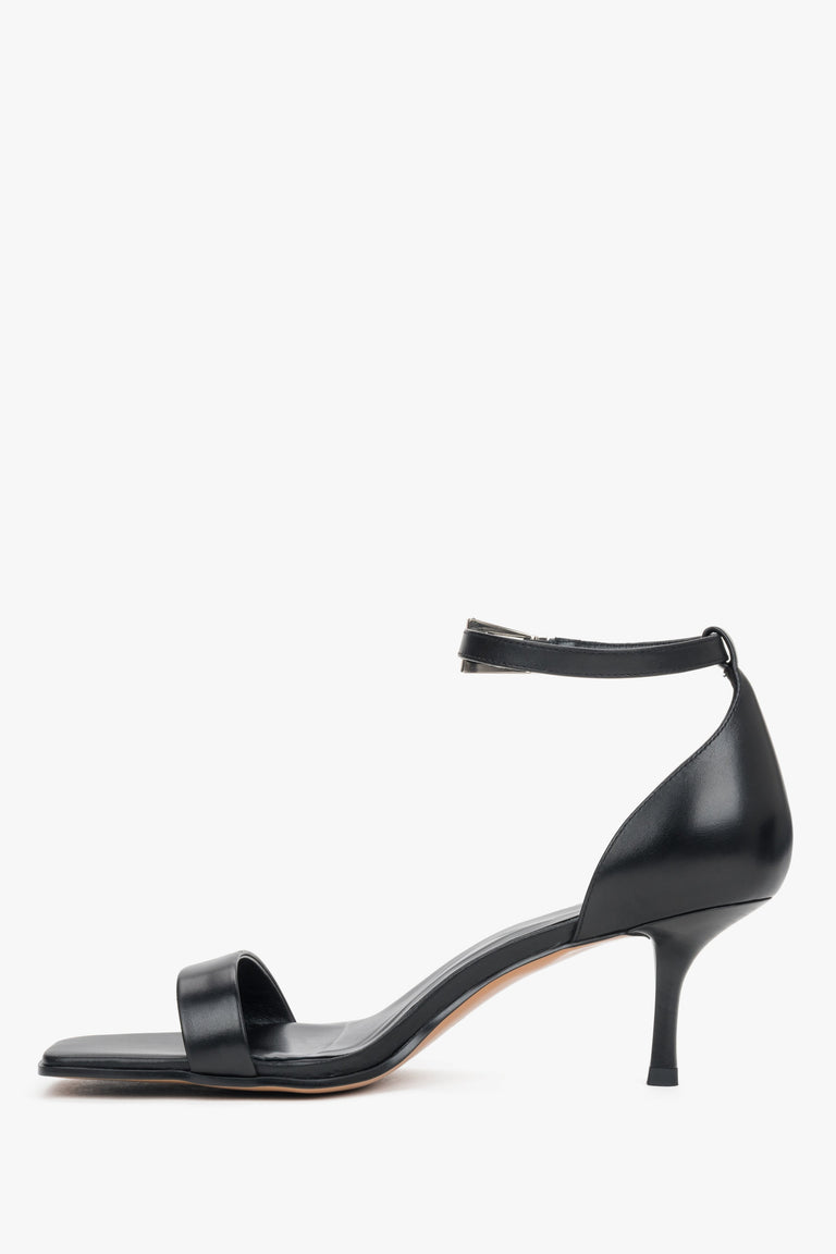 Classic black leather strappy sandals for women with an adjustable ankle buckle.