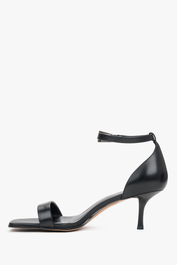 Classic black leather strappy sandals for women with an adjustable ankle buckle.
