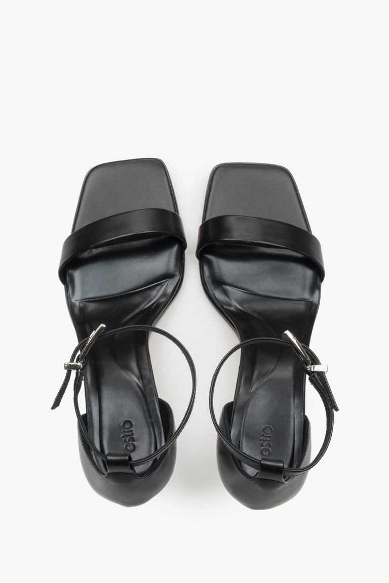 Elegant black leather evening sandals featuring a premium leather interior.
