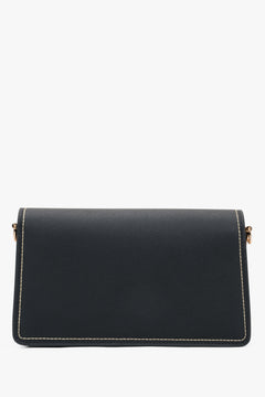 Elegant black women’s shoulder bag with gold details.