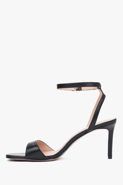 Elegant black leather high-heel sandals with chevro lining.
