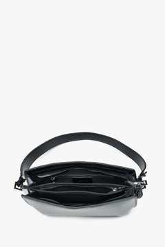 Minimalist leather shoulder bag in a sleek black finish.