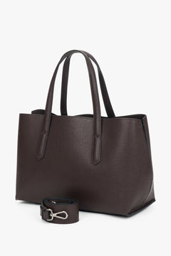 Dark brown women’s genuine leather tote bag with silver hardware and zip closure.