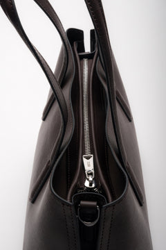 Dark brown women’s genuine leather tote bag with silver hardware and zip closure.