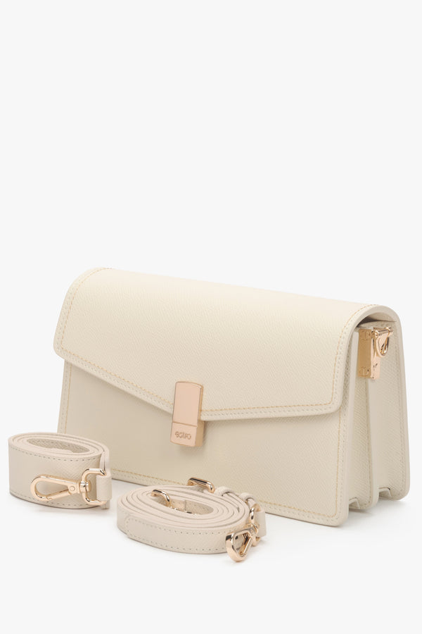 Small creamy beige leather crossbody bag for women with two strap options.