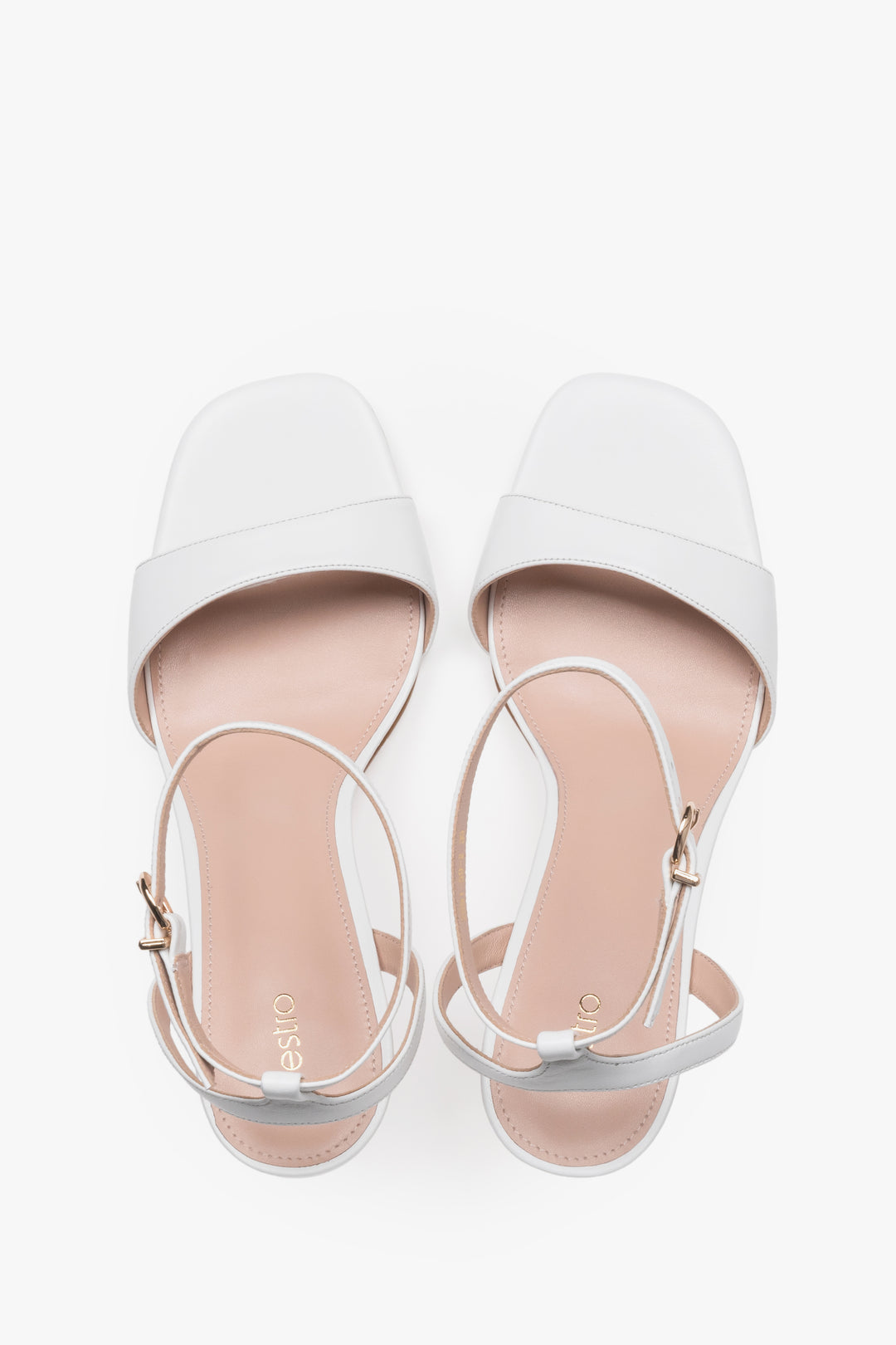 Elegant white leather high-heel sandals with chevro lining.
