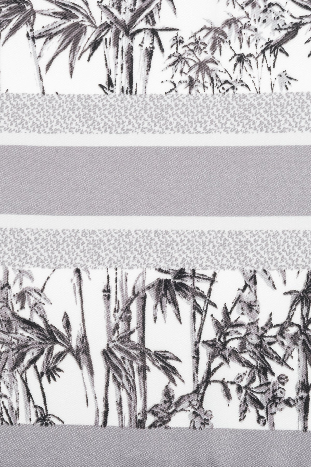 Women’s scarf in grey and white with a jungle motif, by Estro.