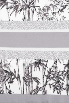 Women’s scarf in grey and white with a jungle motif, by Estro.