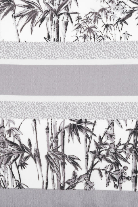 Women’s scarf in grey and white with a jungle motif, by Estro.