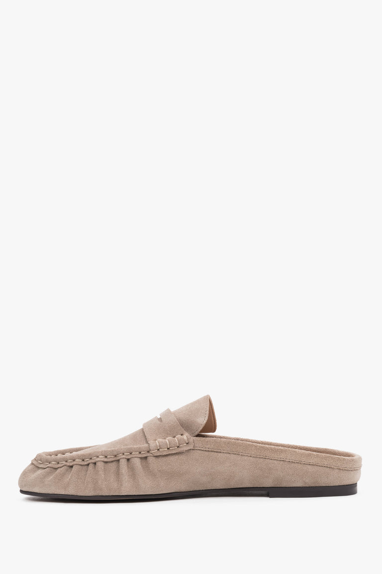 Women’s velour mules showcasing a low, stable sole and a neatly contoured instep design.