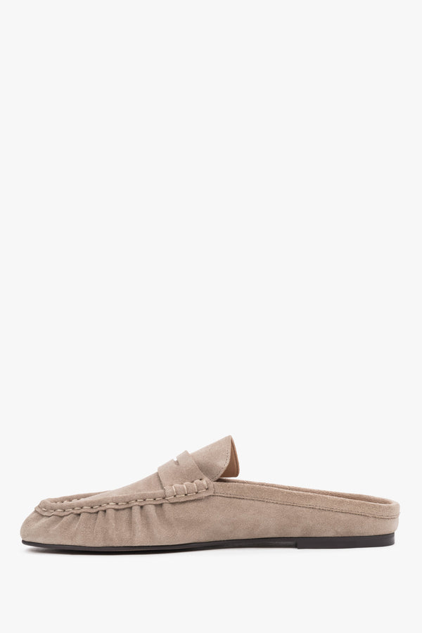 Women’s velour mules showcasing a low, stable sole and a neatly contoured instep design.