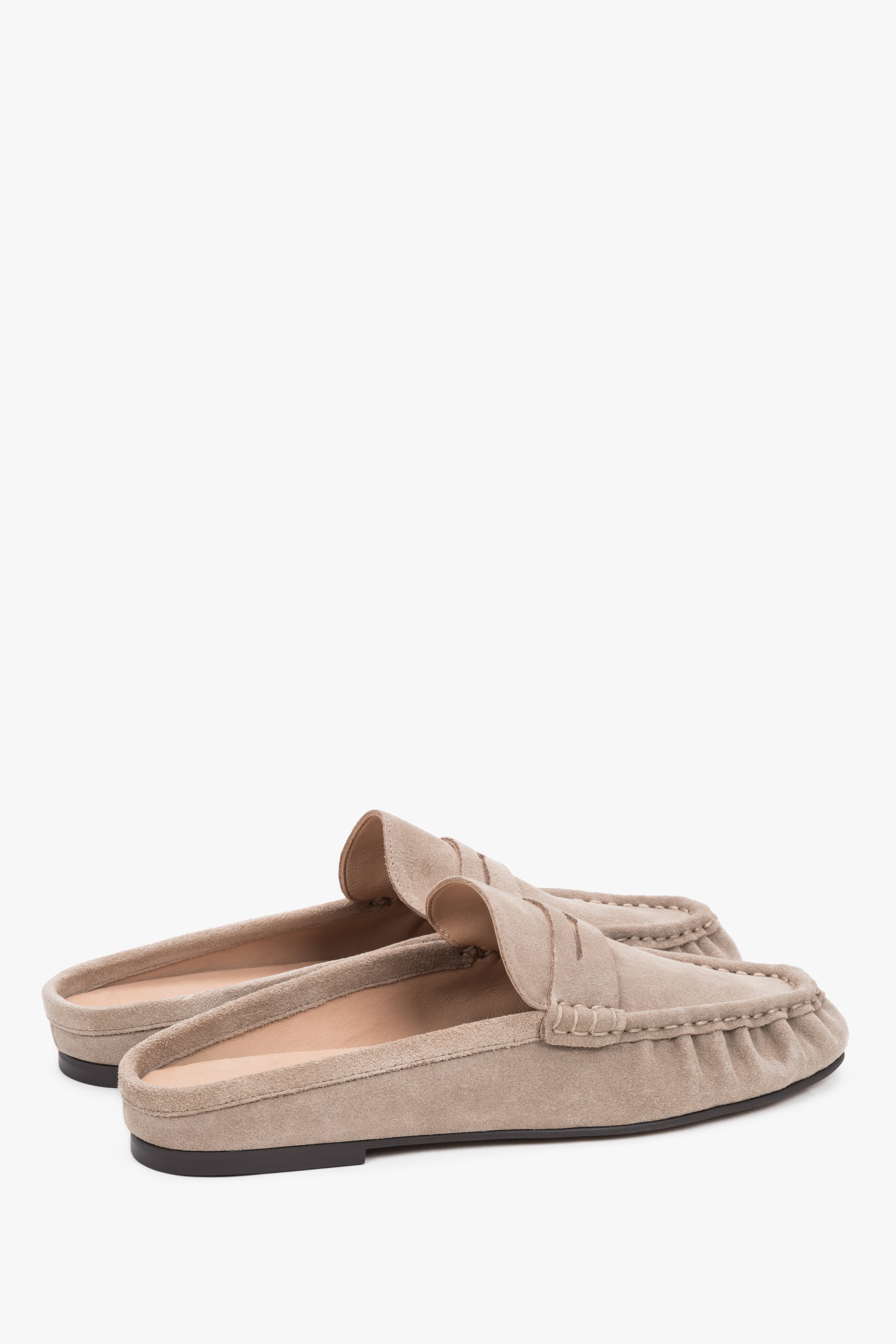 Sole view showing an elegant, smooth outsole made of abrasion-resistant tunite with subtle brand embossing.