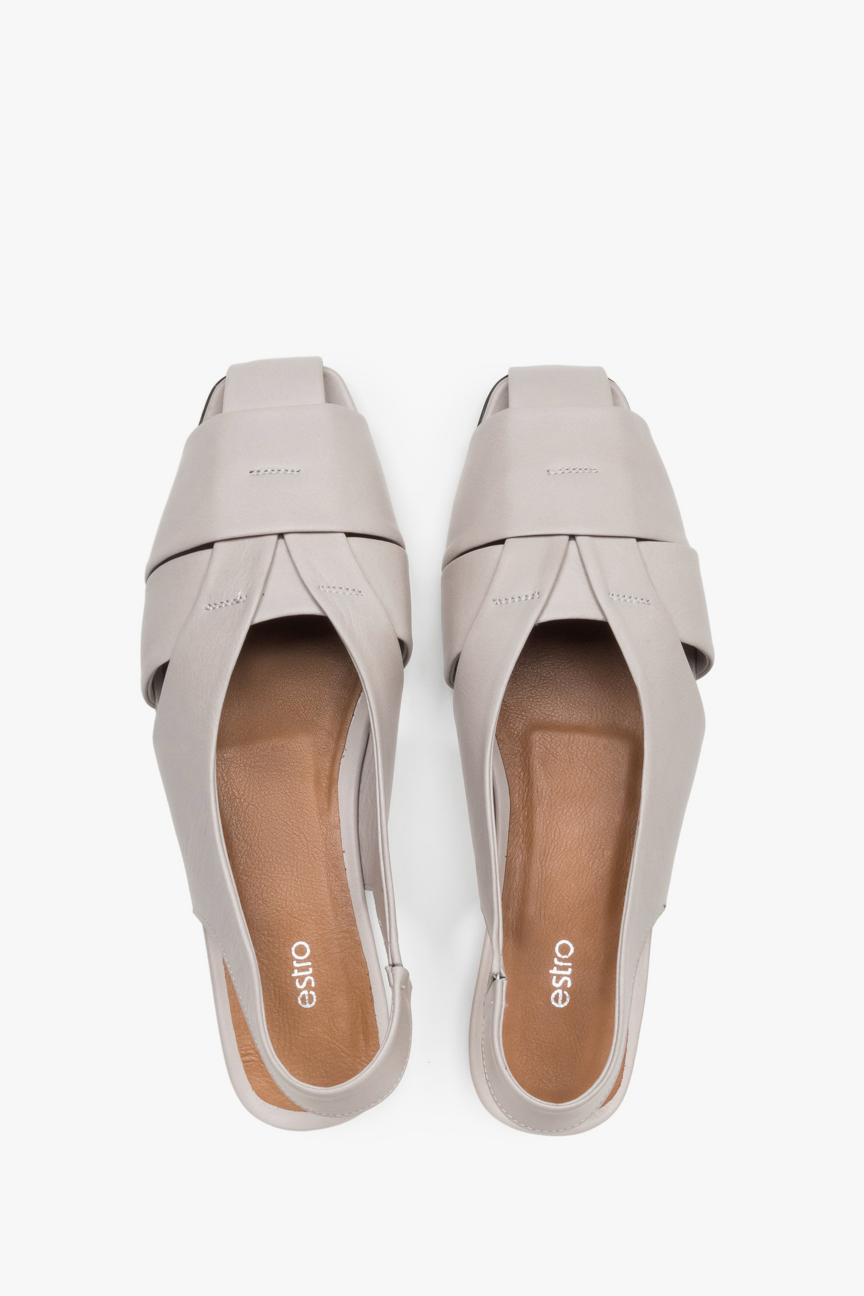 View from above of grey leather sandals with covered toes.
