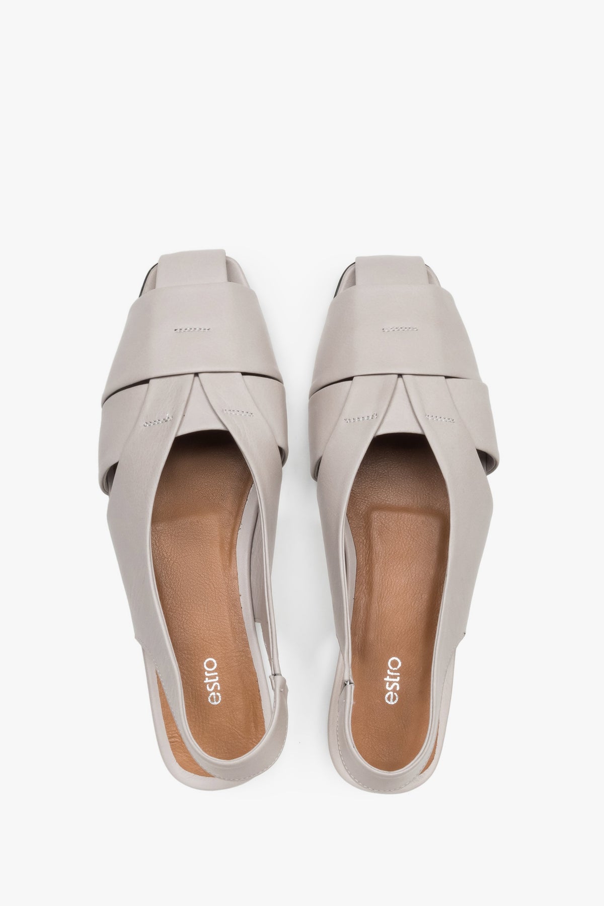 View from above of grey leather sandals with covered toes.