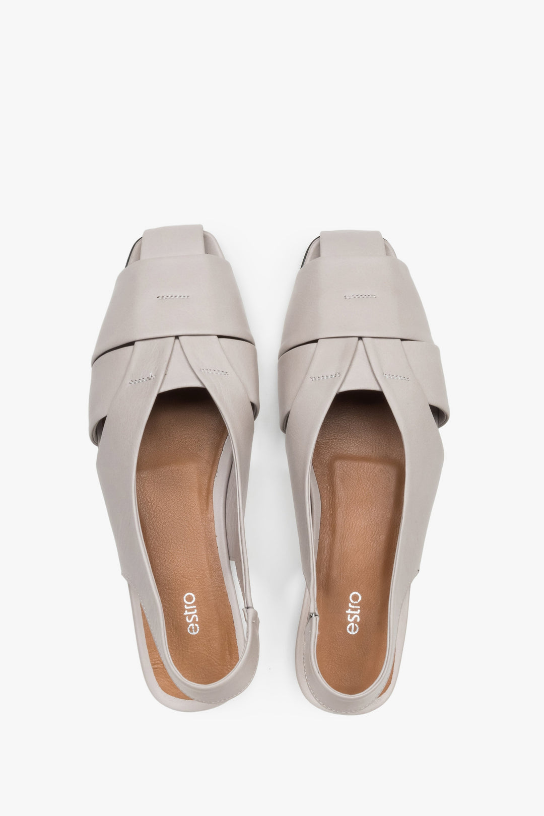 View from above of grey leather sandals with covered toes.