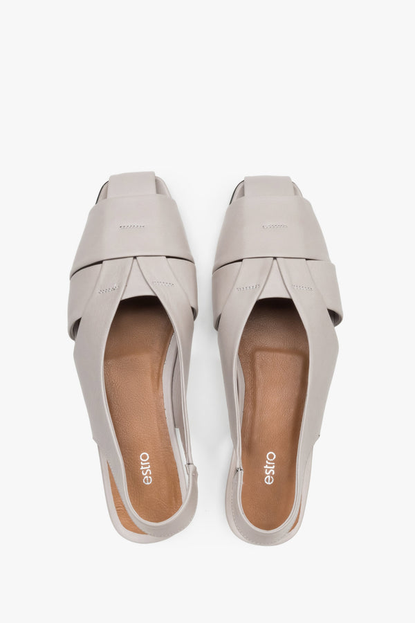 View from above of grey leather sandals with covered toes.