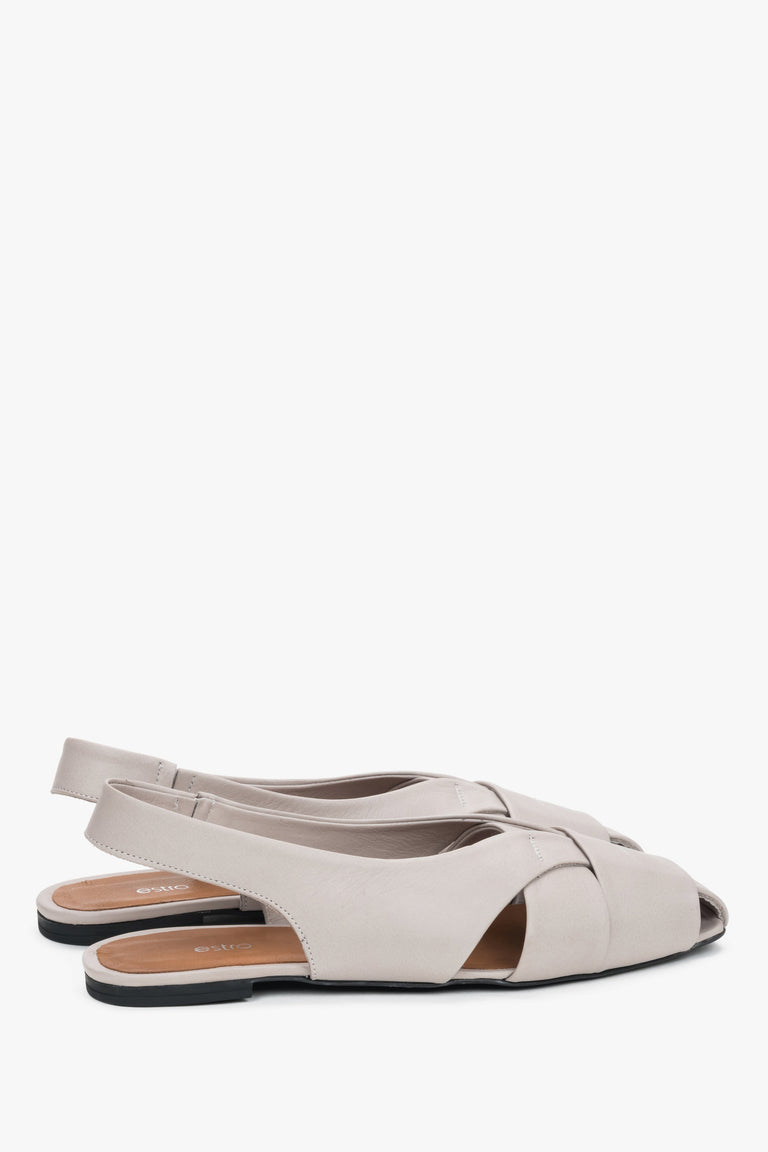 Close-up of closed-toe line on grey leather sandals.