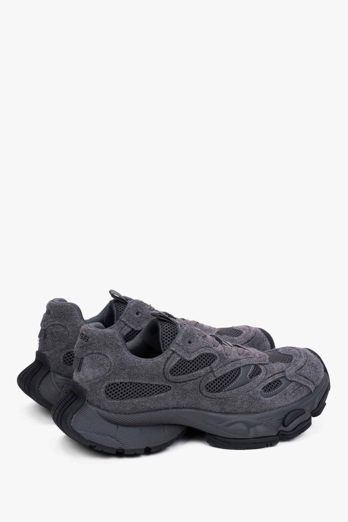 Women's grey velour platform sneakers – back view highlighting the stable heel support and geometric sole structure.