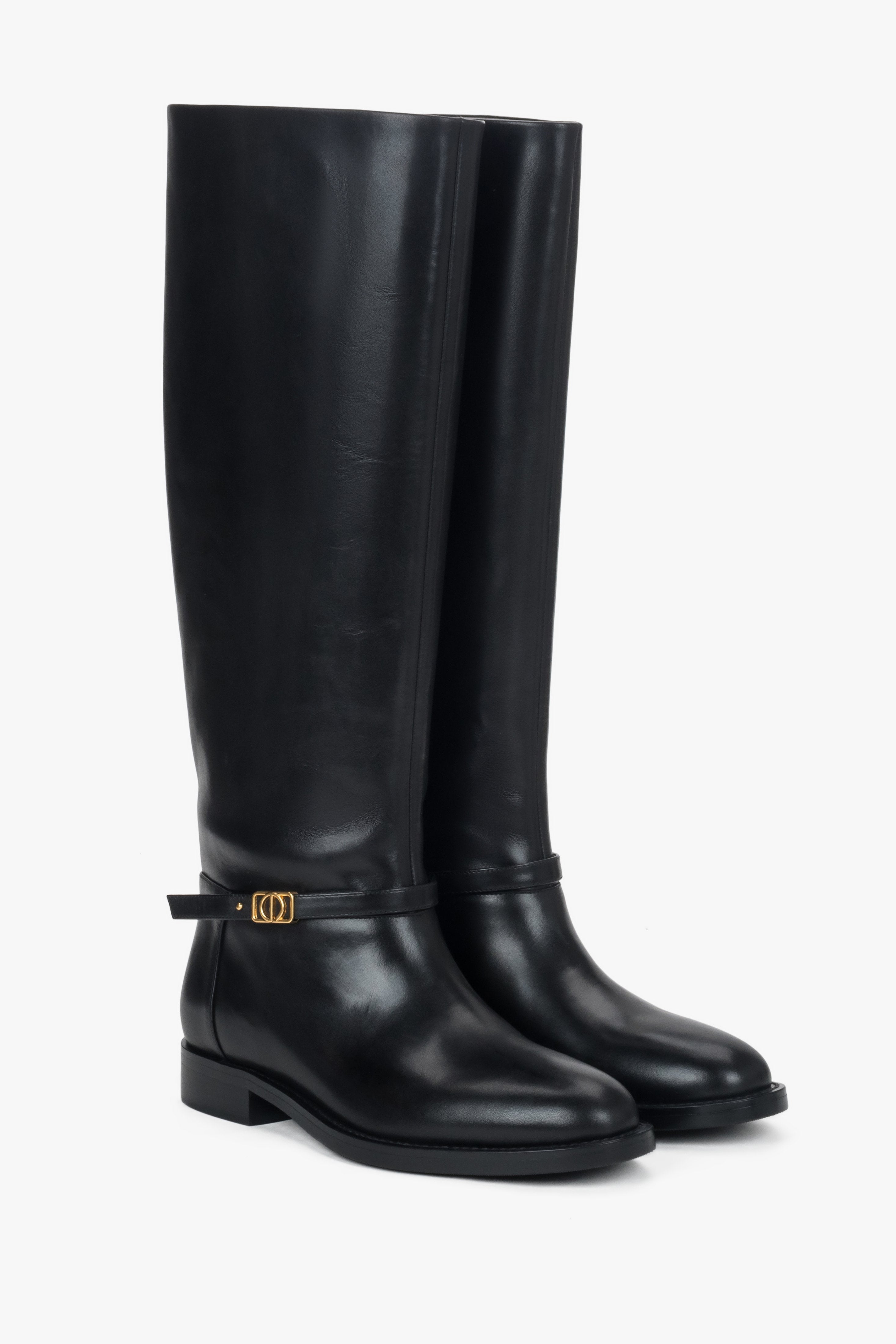 High black women's boots made of genuine leather with a gold buckle.