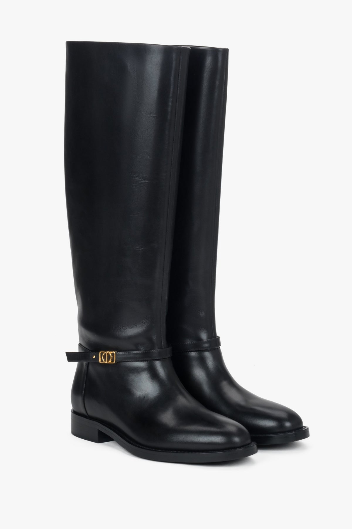 High black women's boots made of genuine leather with a gold buckle.
