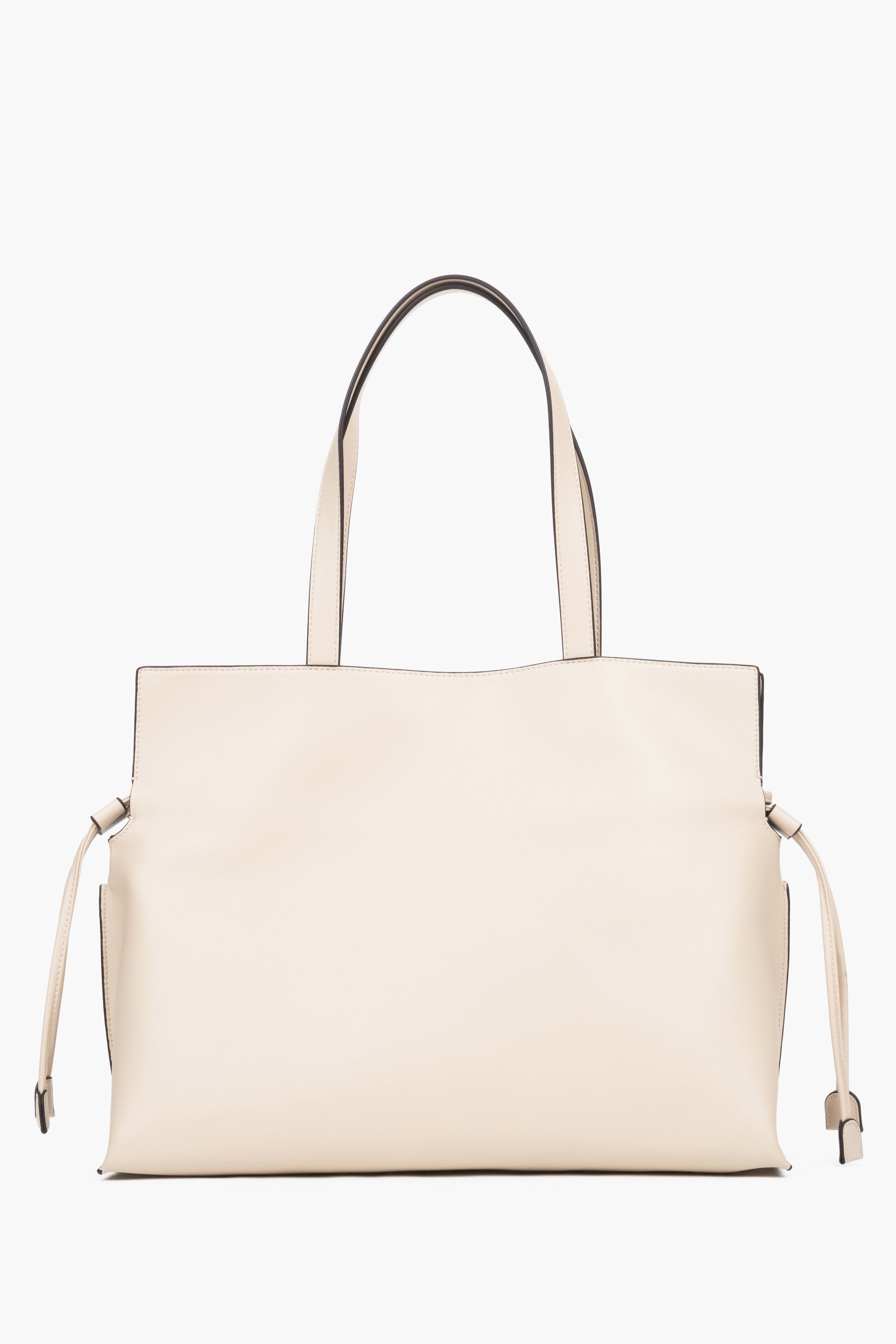 Close-up of a beige bag featuring adjustable side drawstrings that elegantly gather the sides and transform the silhouette of the bag.