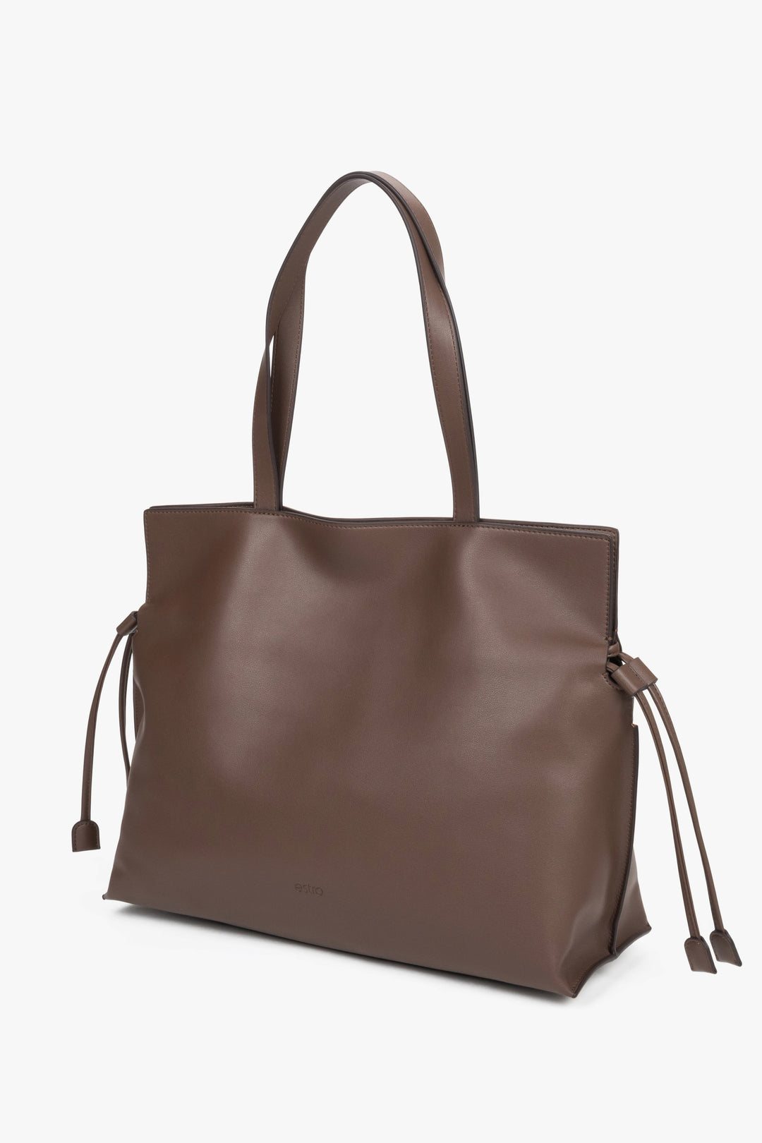 Leather shopper bag with a 14 cm width and loose side ties, showcasing the softness and refined texture of smooth genuine leather.