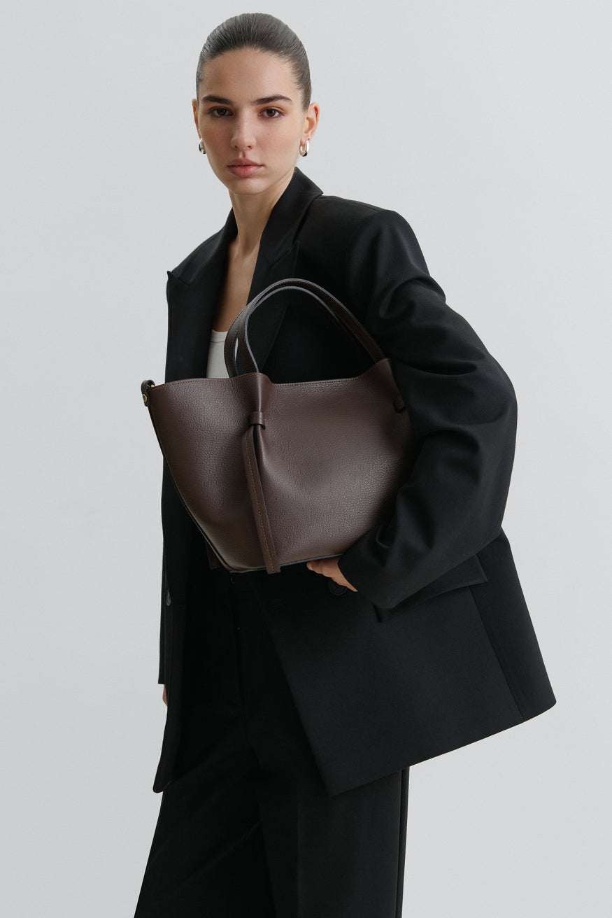 Women's dark brown boat-shaped handbag made of Italian genuine leather.