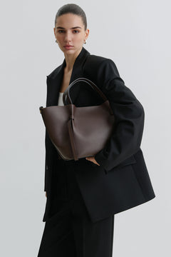 Women's dark brown boat-shaped handbag made of Italian genuine leather.