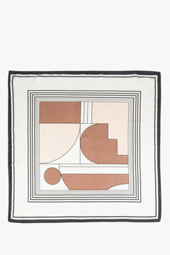 Women's scarf in light beige, brown, and black colors with abstract pattern.