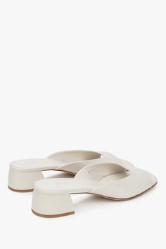 With a low heel, white women’s genuine leather mules by Estro.