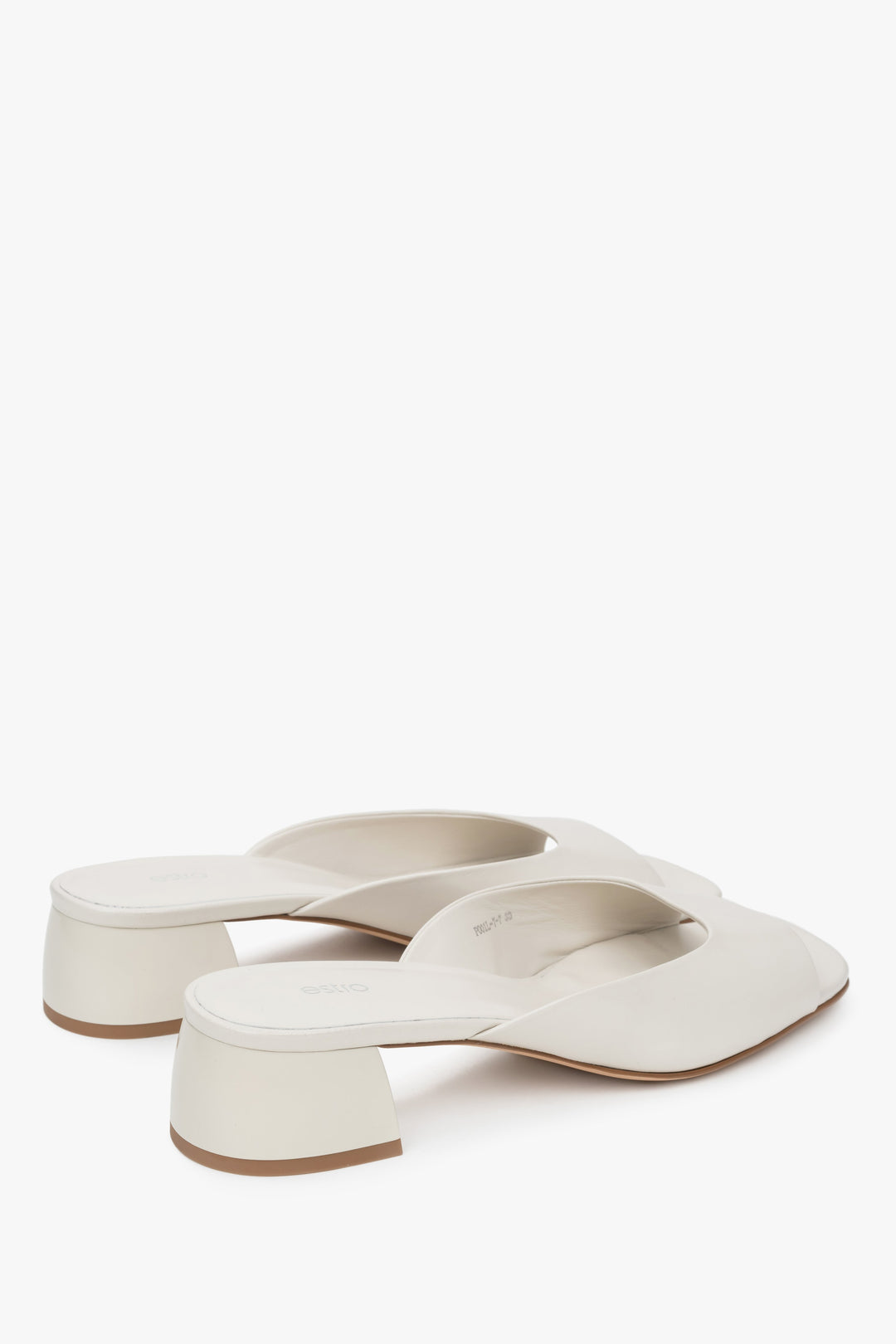 With a low heel, white women’s genuine leather mules by Estro.
