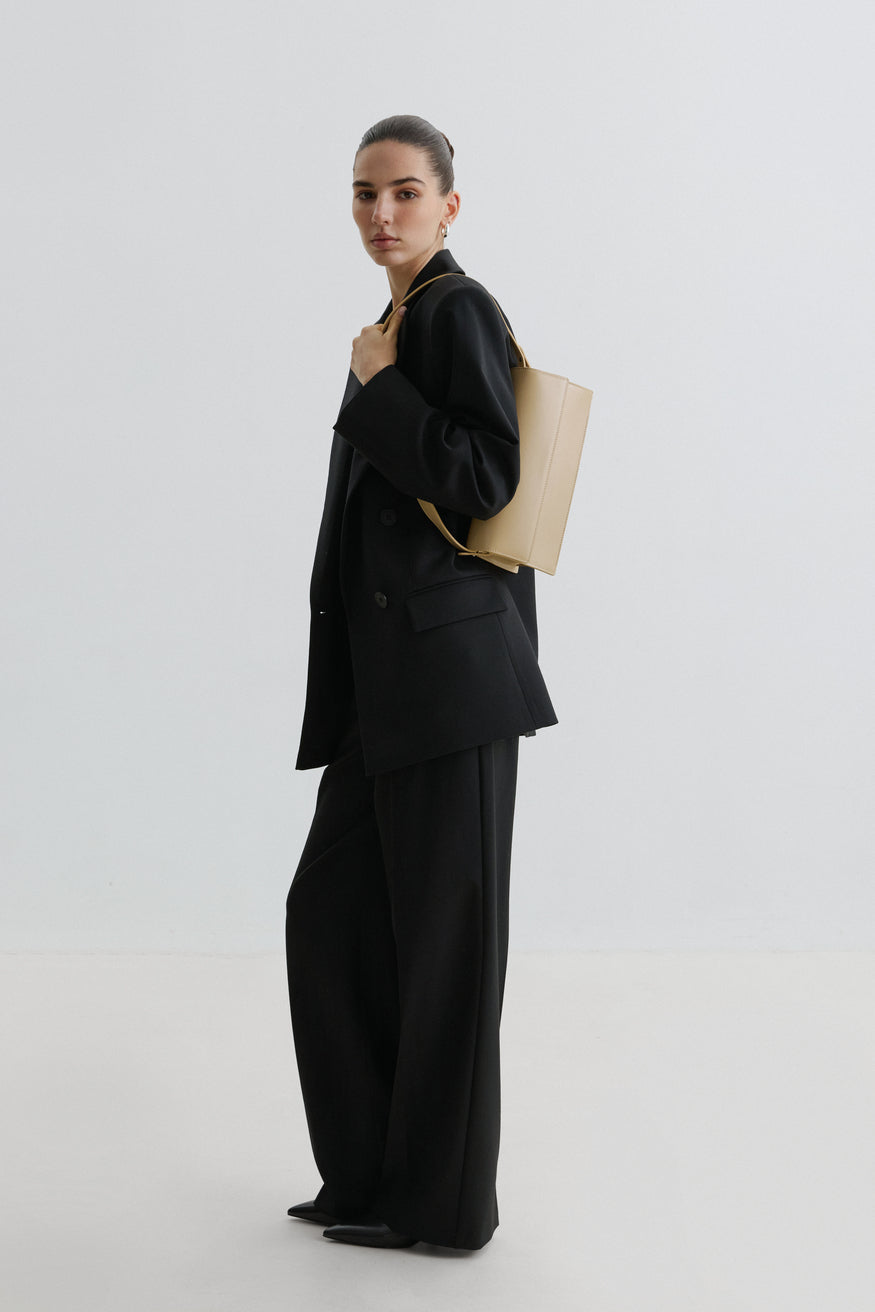Versatile Light Beige Leather Bag with Adjustable Strap .