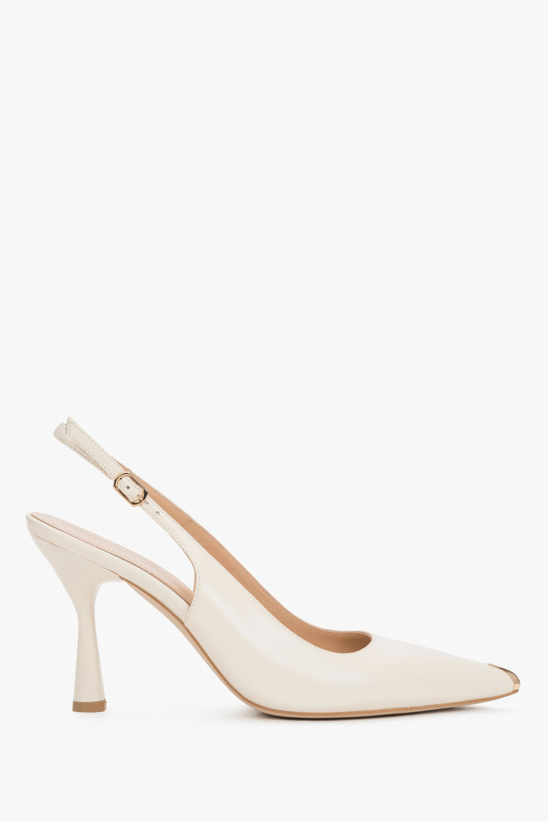 Elegant women’s shoes showcasing a stable flared heel profile and the precise finish of a metal buckle fastening.