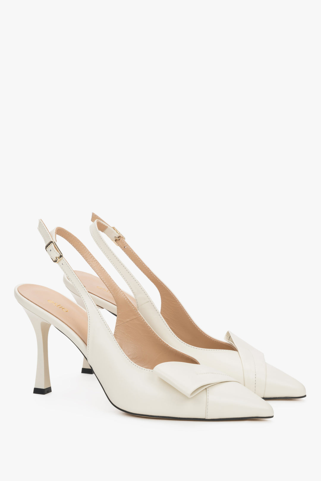 Light beige leather Estro slingback pumps on a high stiletto heel, featuring a deep vamp, a geometric toe detail, and a slim strap around the heel.