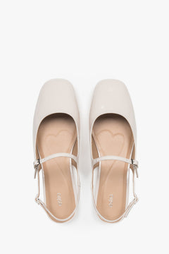 Estro women's slingback flats in light beige patent leather.