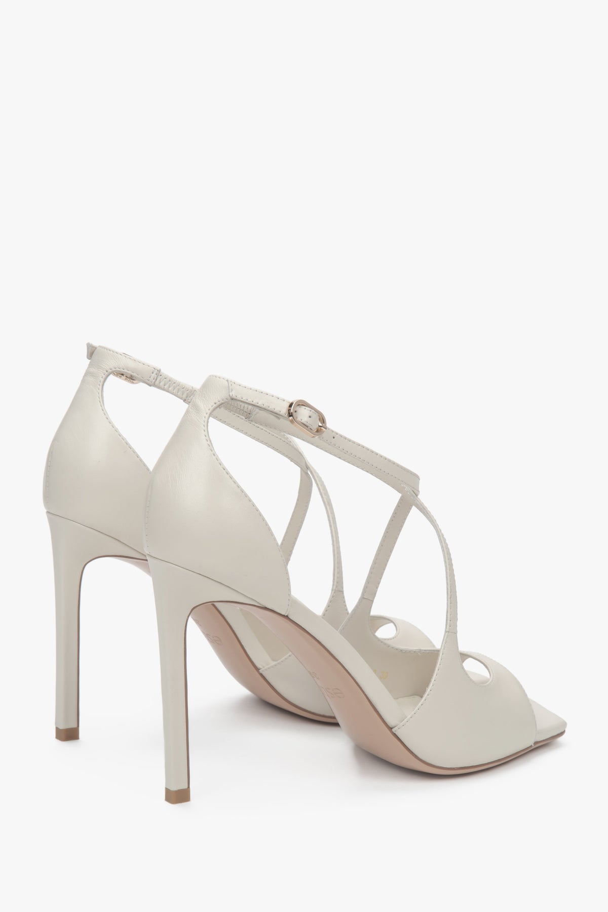 Women’s light beige stiletto sandals with decorative fastening by Estro.