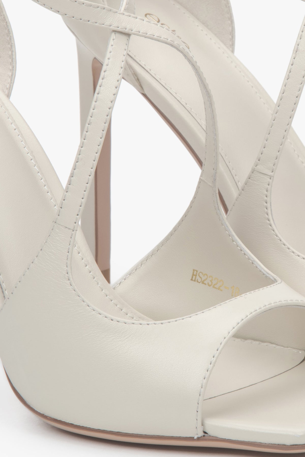 Women’s light beige stiletto sandals with decorative fastening by Estro.