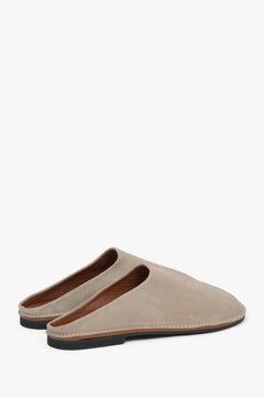 Delicate light beige velour mules for women, perfect for adding a touch of elegance to any outfit.