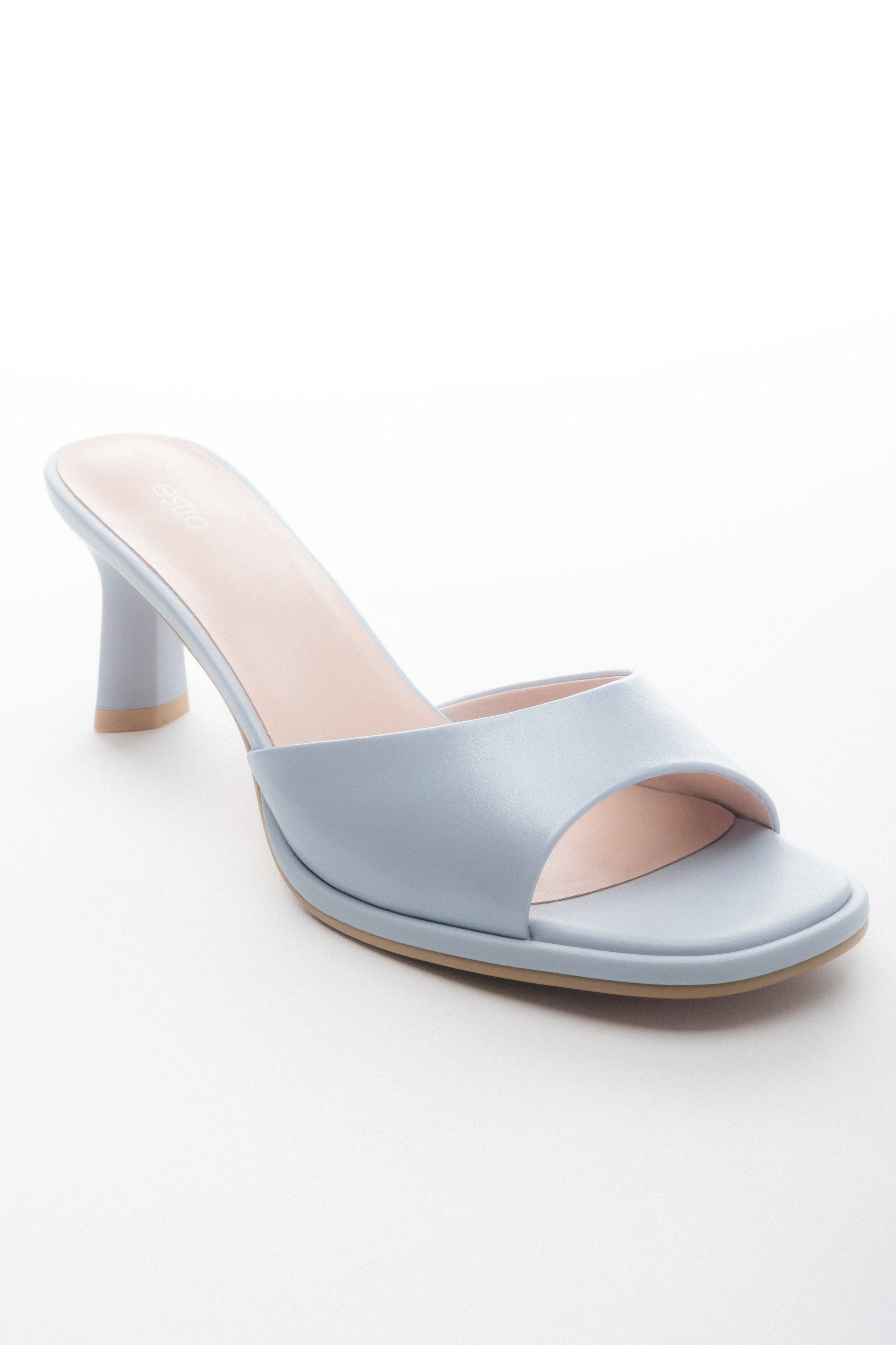 Light blue women’s heeled leather mules.
