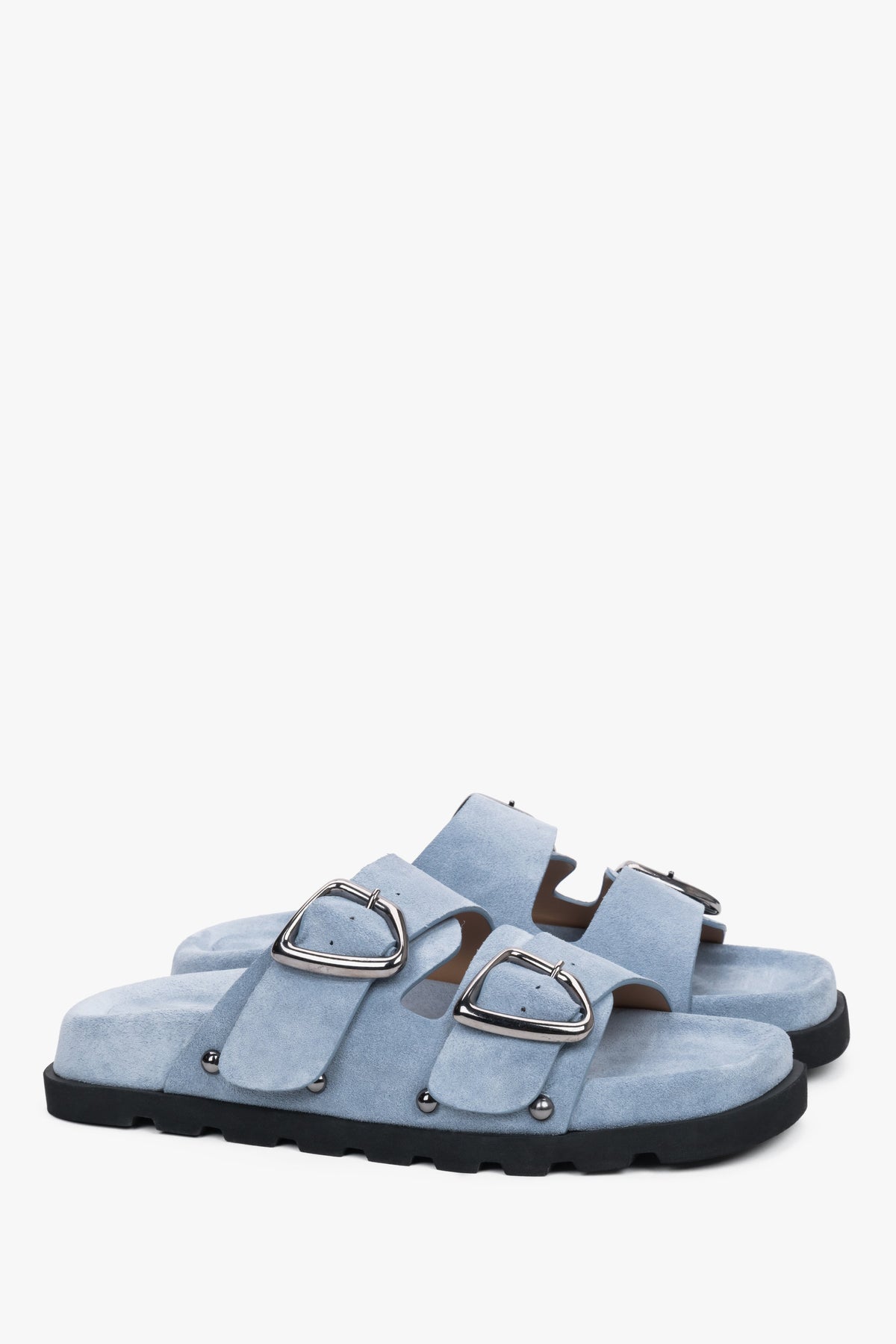 Light blue women’s velour slides with a silver buckle and studs.