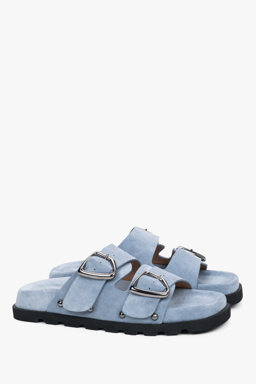 Light blue women’s velour slides with a silver buckle and studs.