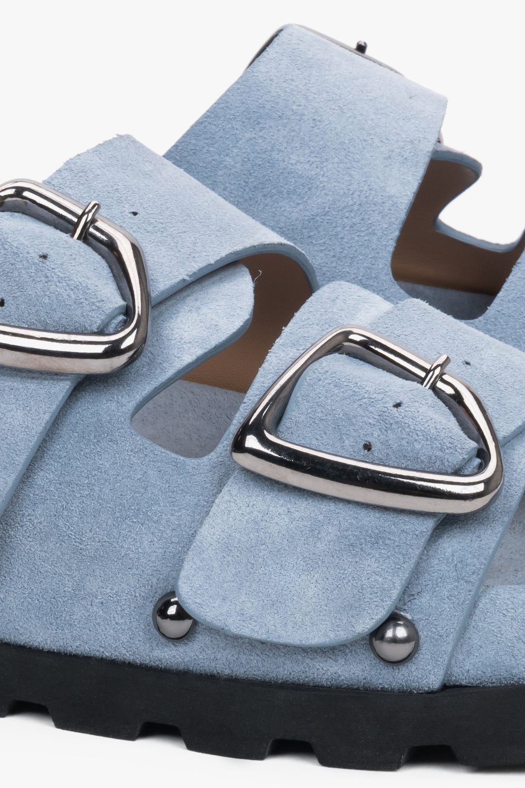 Light blue women’s natural velour slides with a silver buckle and studs – detail close-up.