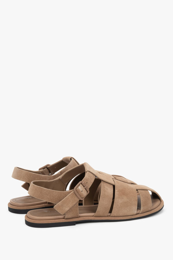 Soft natural velour sandals with an adjustable buckle strap and cage design.