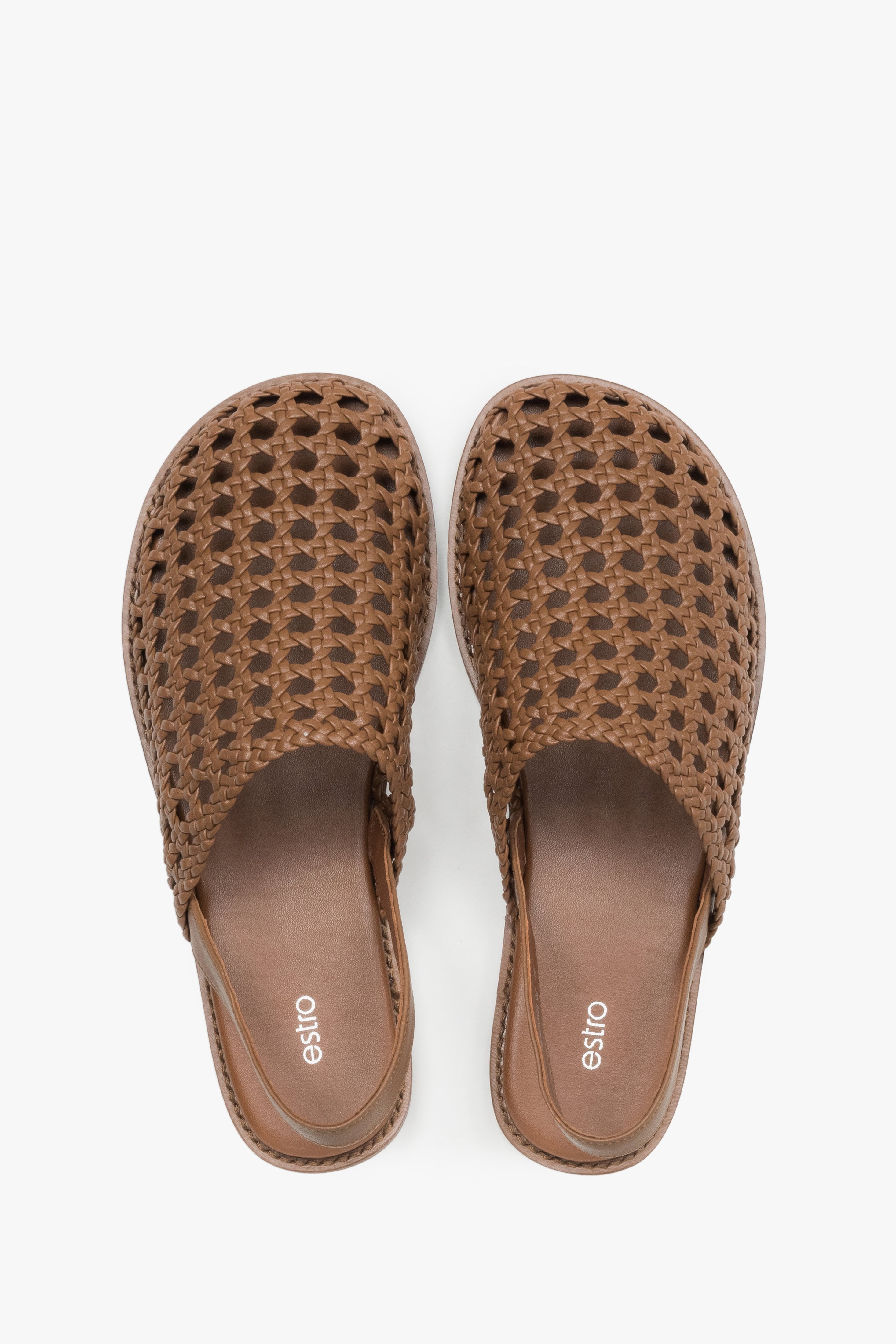 Women's flat leather sandals with an intricate openwork weave.