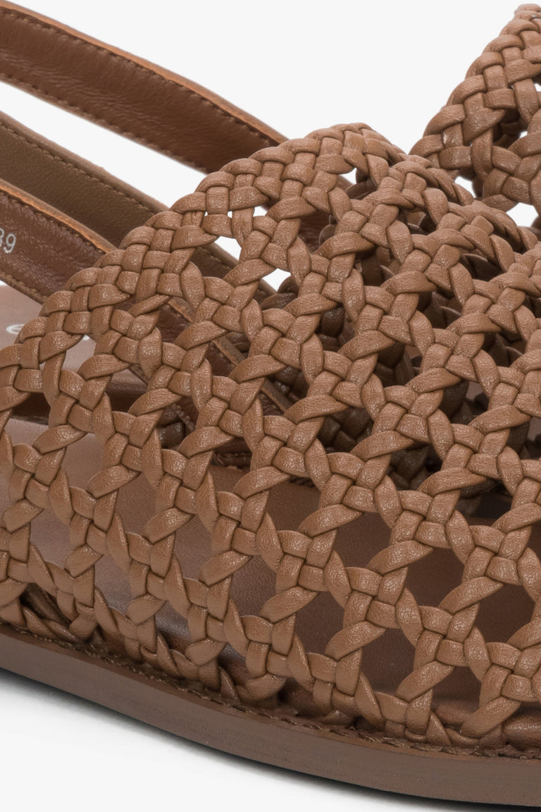 Genuine leather tan sandals with a breathable perforated upper.